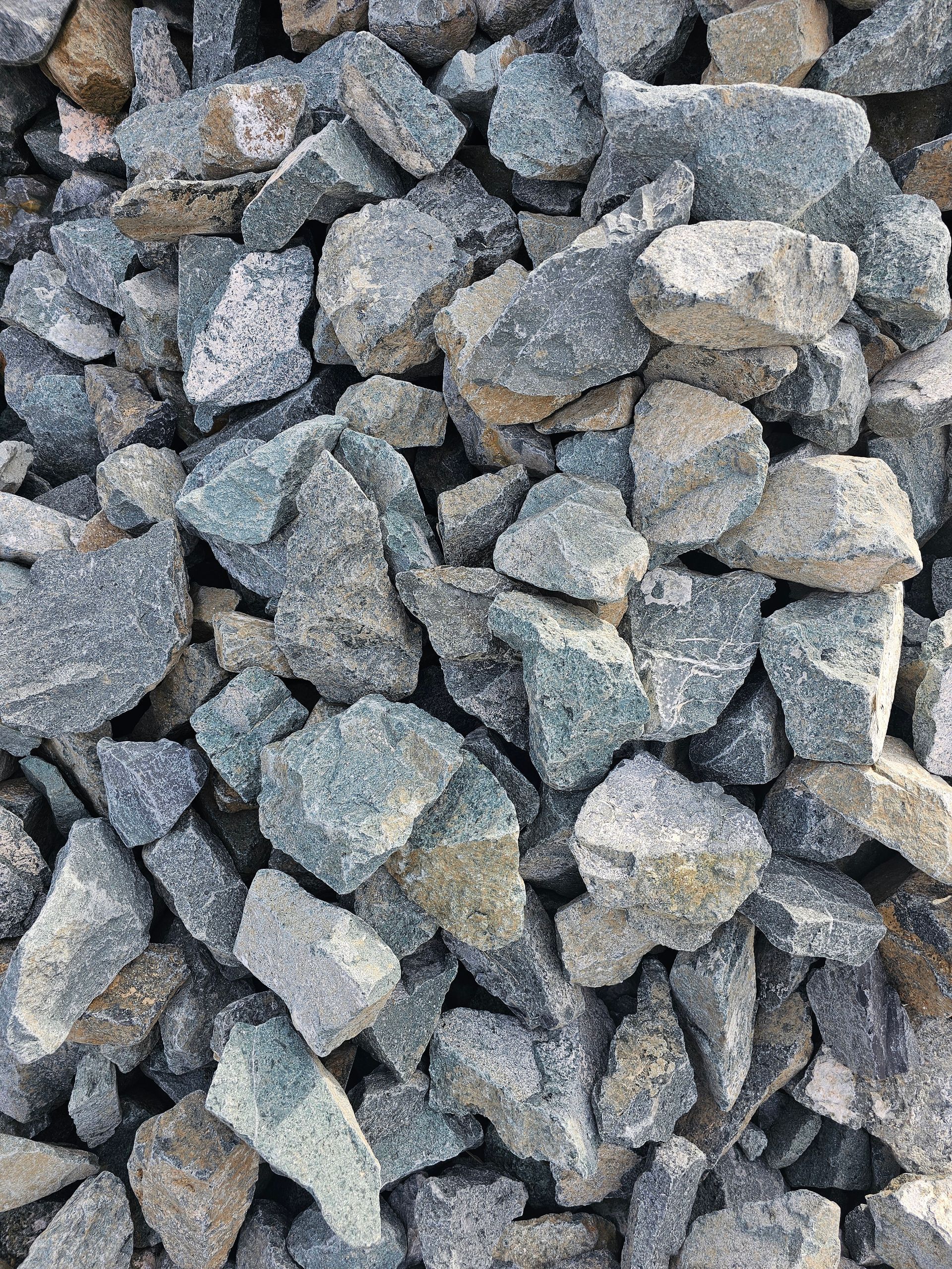 Pile of angular, grey and beige gravel rocks - Palms Landscape Supplies in Forster, NSW