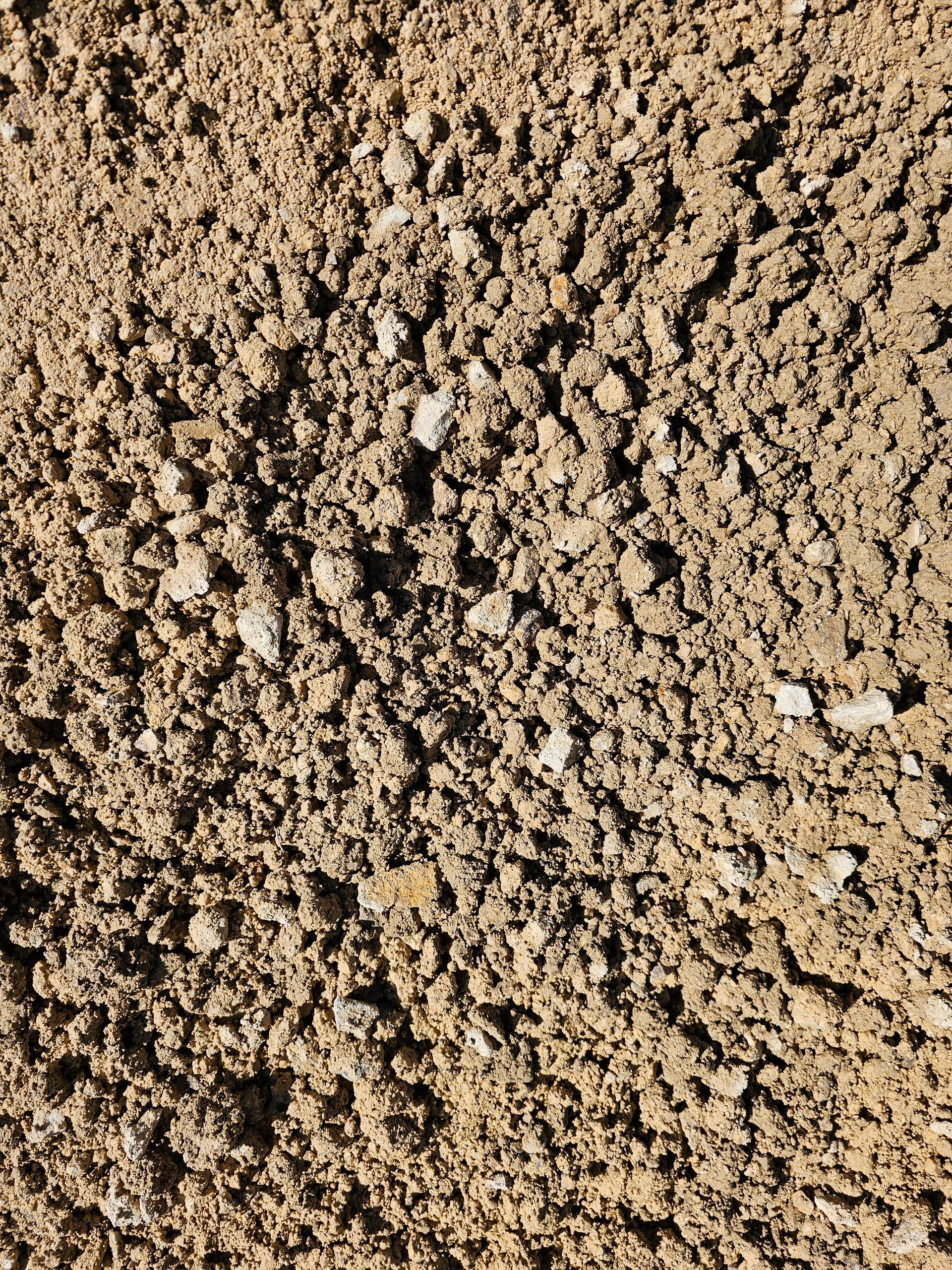 Brown, textured soil with small rocks and clumps - Palms Landscape Supplies in Forster, NSW