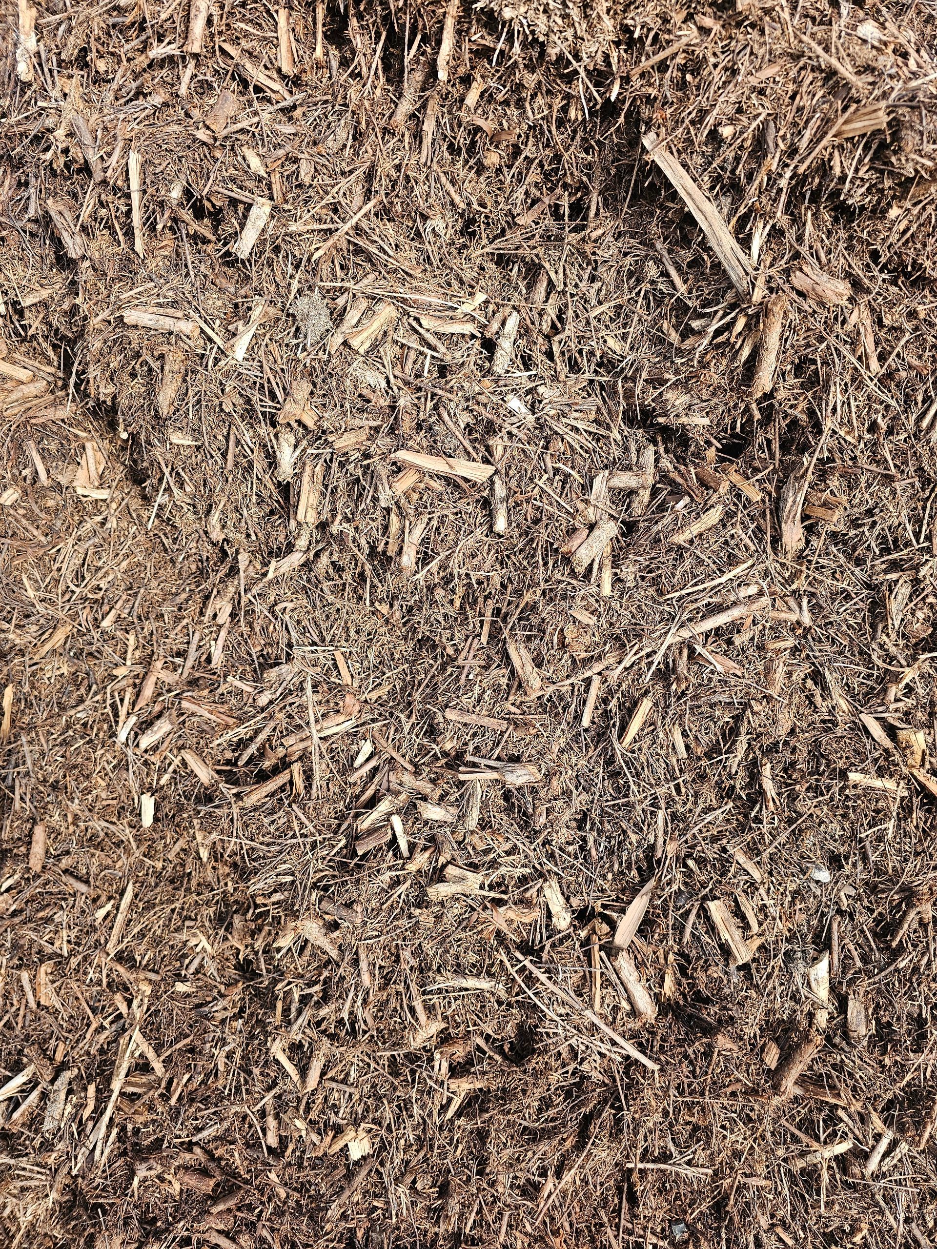 Brown mulch texture, small wood chips and fibres - Palms Landscape Supplies in Forster, NSW