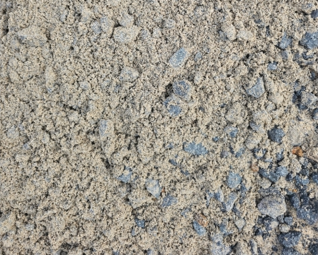 Close-up of gravel and fine particles on a textured surface, grey and tan - Palms Landscape Supplies in Forster, NSW