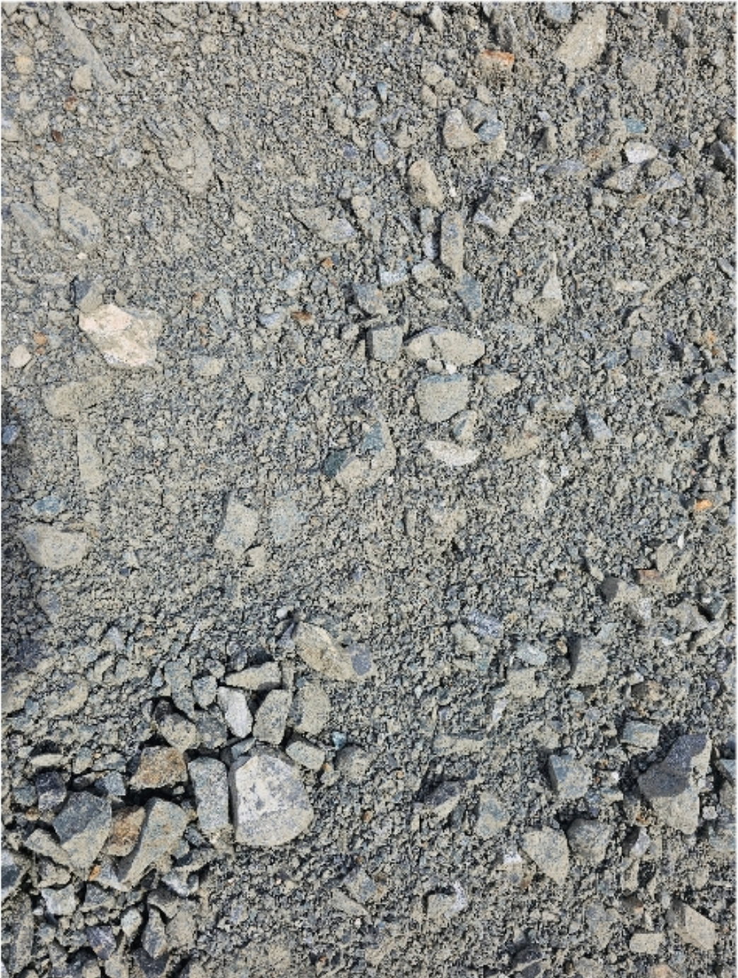 Gravel ground with various sized grey rocks and pebbles - Palms Landscape Supplies in Forster, NSW