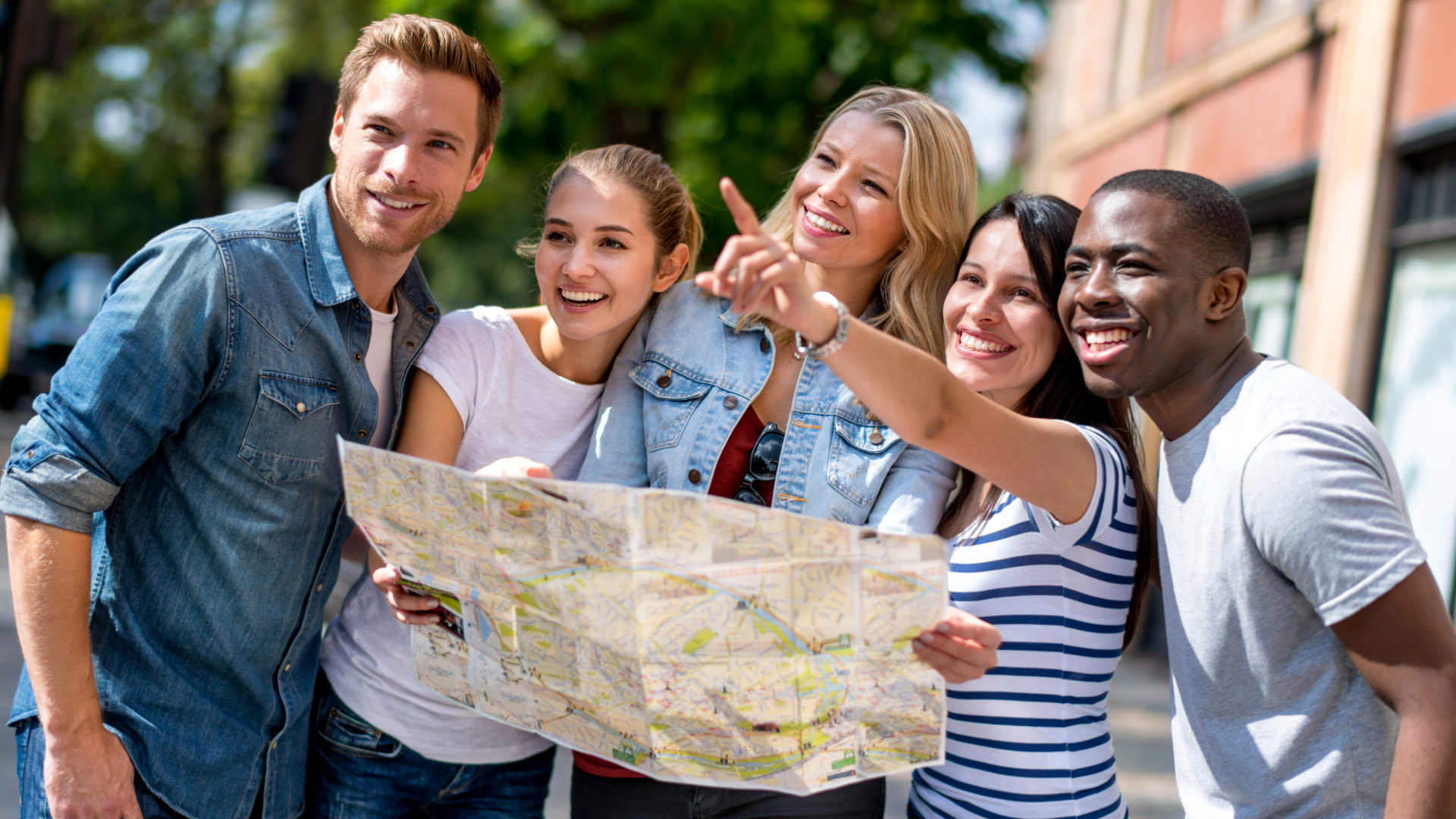 A group of young people are looking at a map.