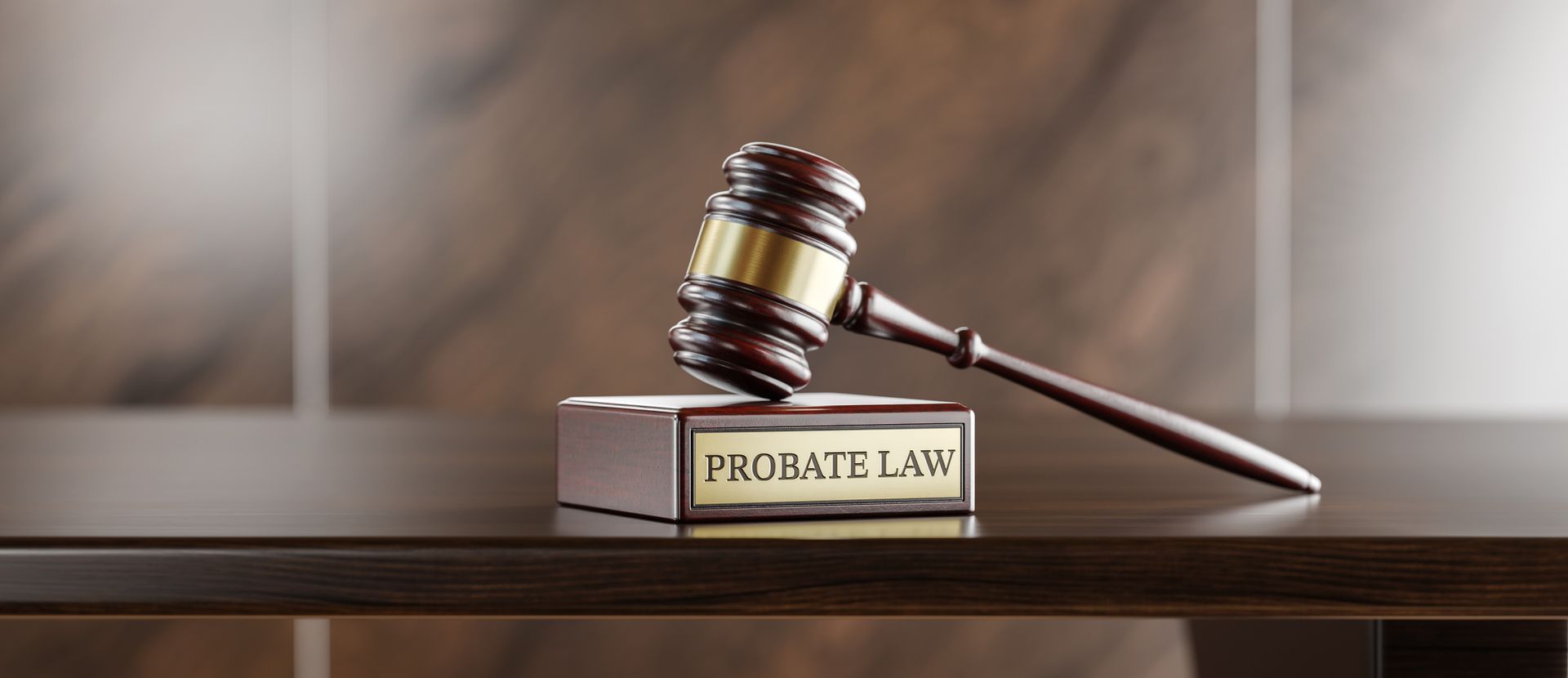 Wooden gavel rests on book labeled probate law, symbolizing the role of a probate lawyer.