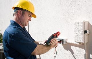 Electrical Repair — Man Fixing a Electrical Meter in Mansfield, OH