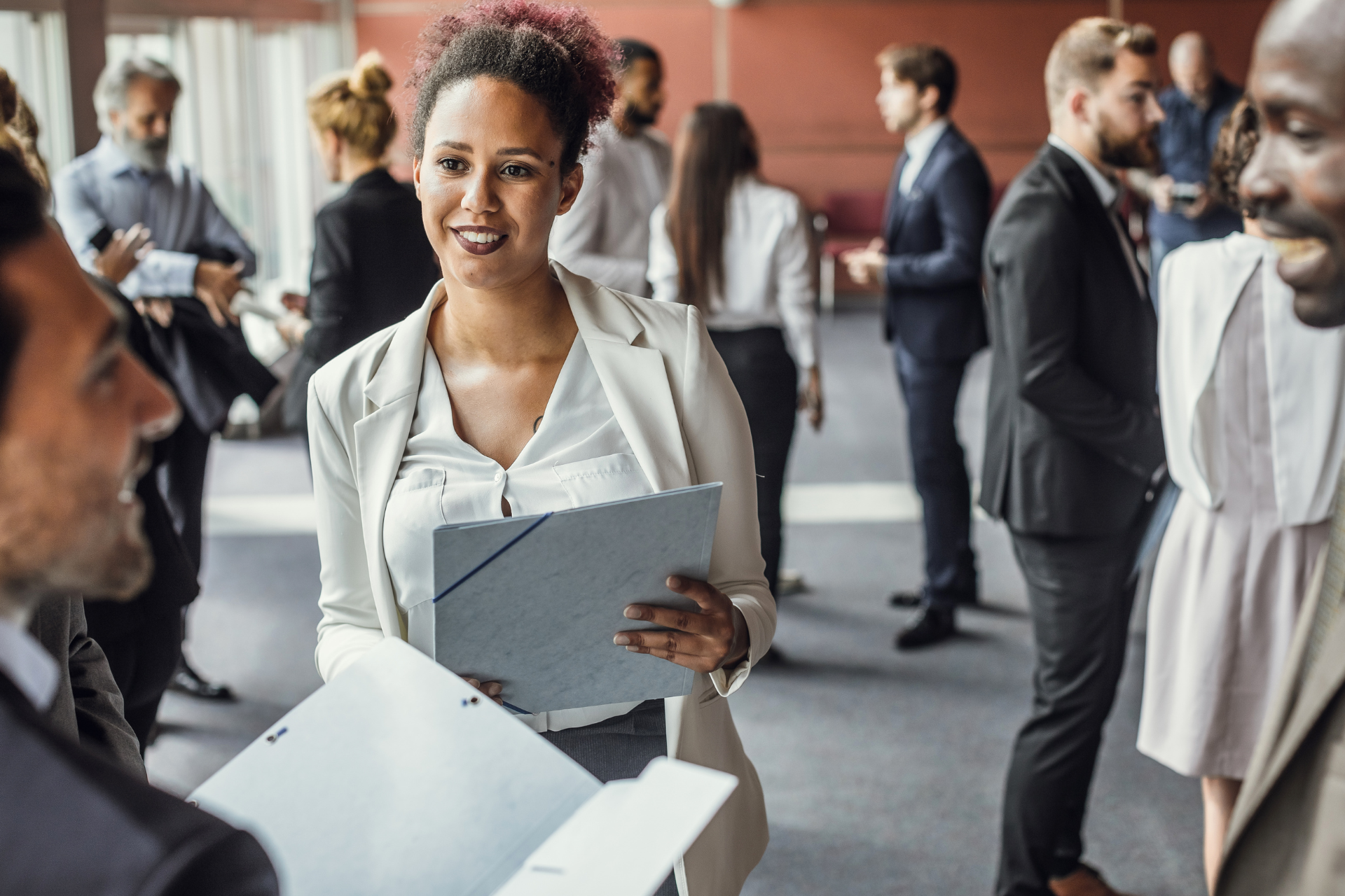 People in suits and blazers at work