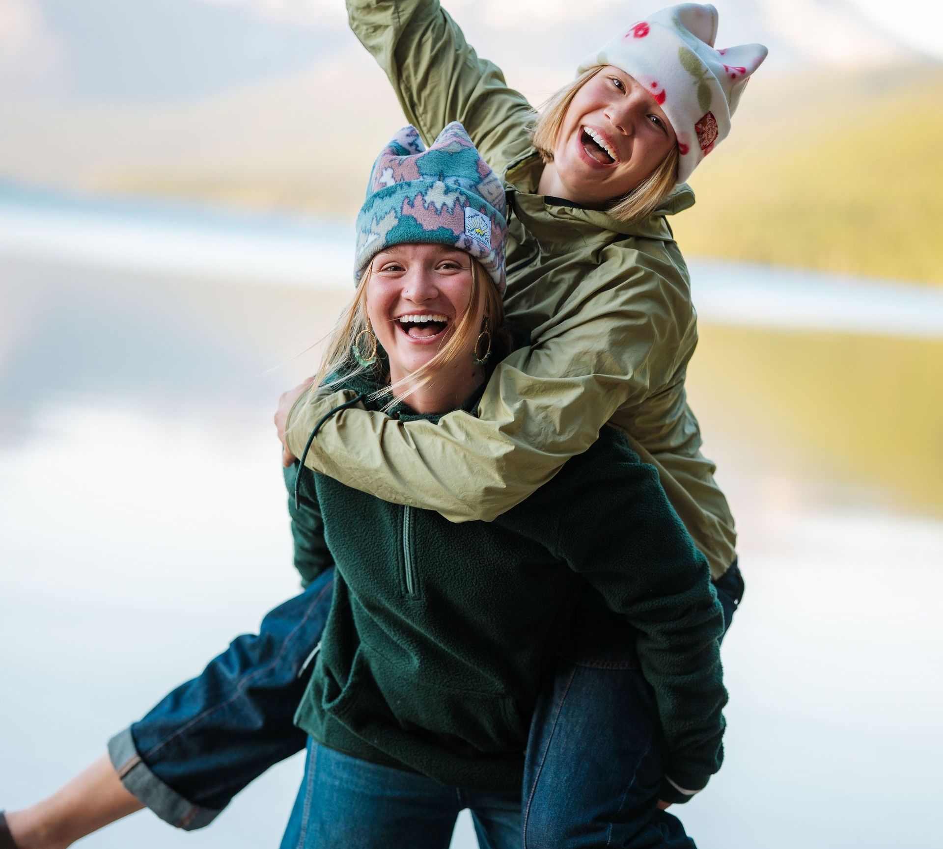 A woman is carrying another woman on her back
