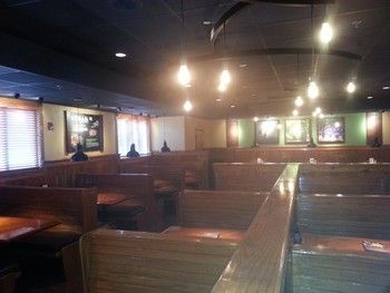 A restaurant with a lot of tables and booths