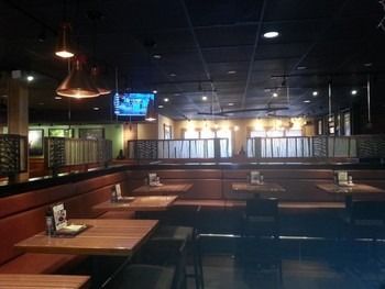 The inside of a restaurant with tables and chairs