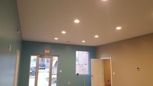 A room with a ceiling that has a lot of lights on it.