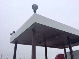 A white canopy with a light on top of it