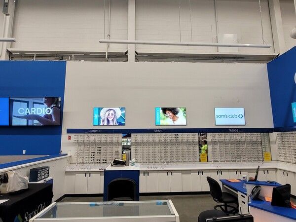 The inside of an optical store with a sign that says cardio
