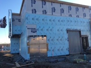 A building is being built with a lot of insulation on it.