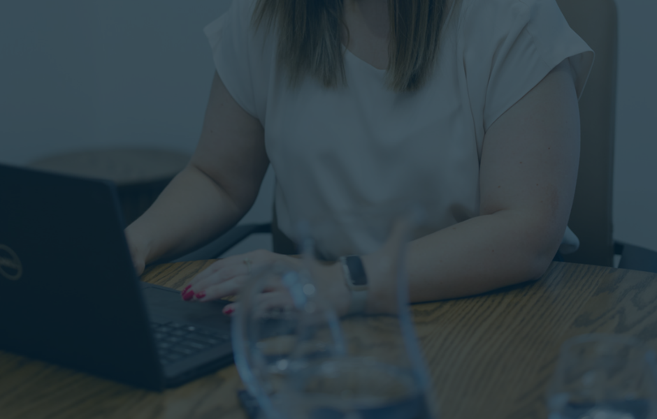 A key is hanging from a keyhole with a house keychain attached to it symbolising what you can achieve with Robards.