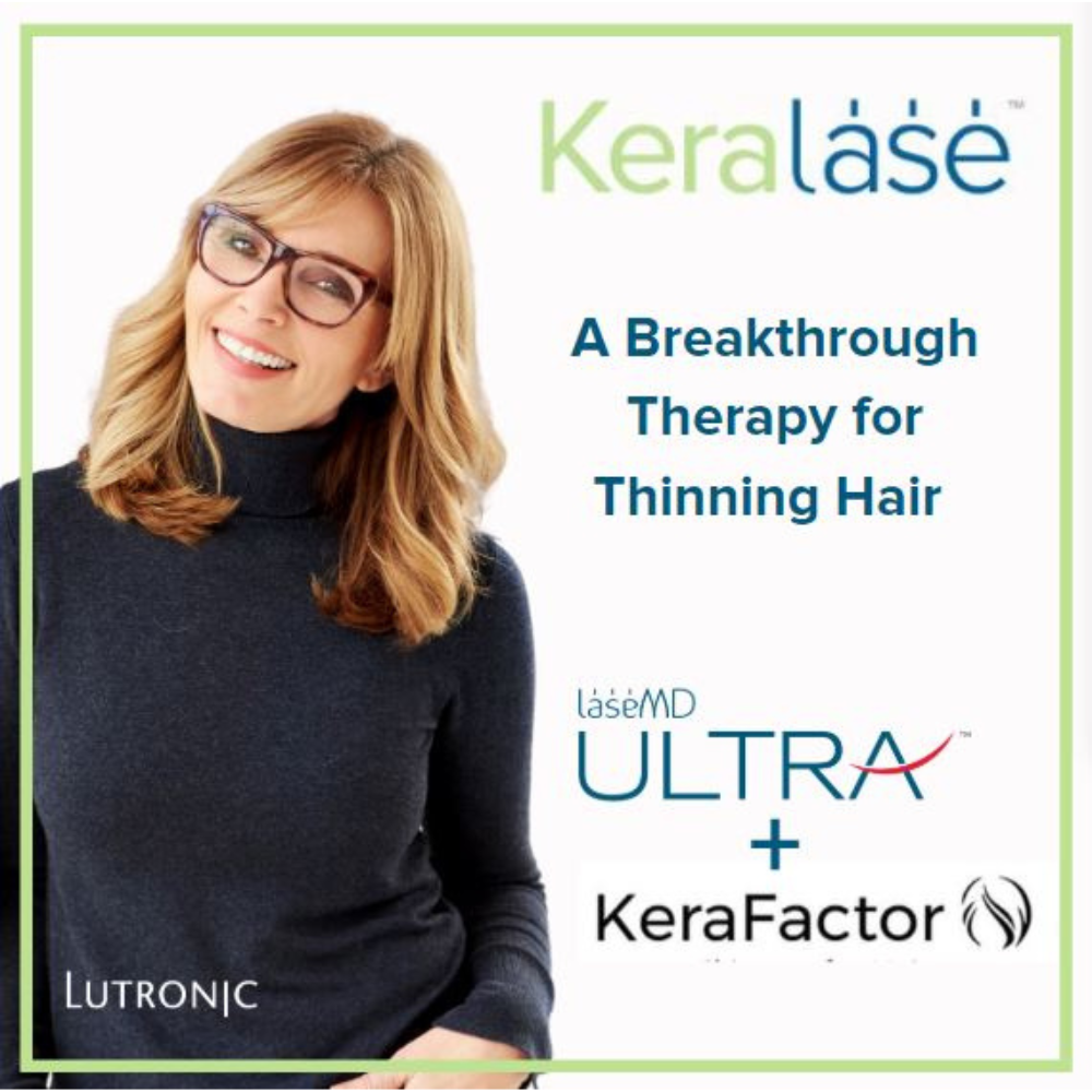 A woman wearing glasses and a black turtleneck is smiling in front of a sign that says keralase