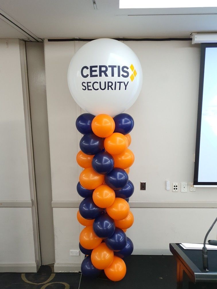 Balloon column for Certis Security with a logo on top, and orange and blue balloons below.