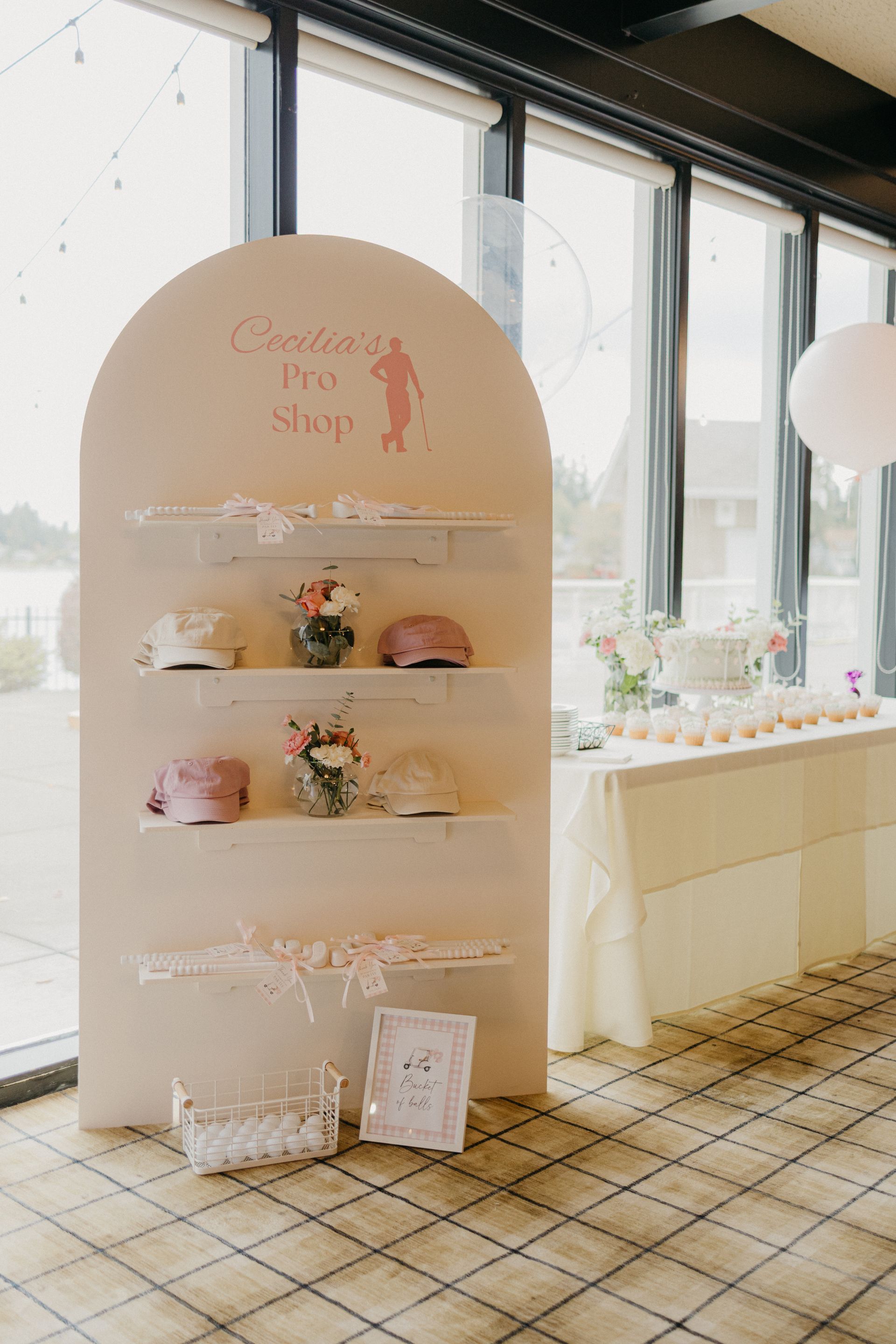 A beige arched display board labeled 