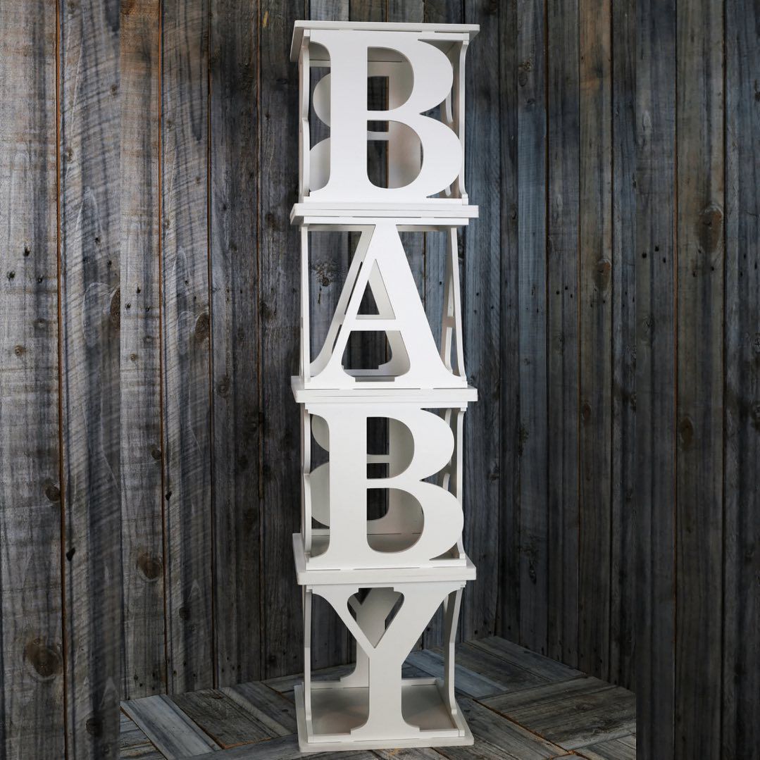 A stack of white letters that spell out the word baby