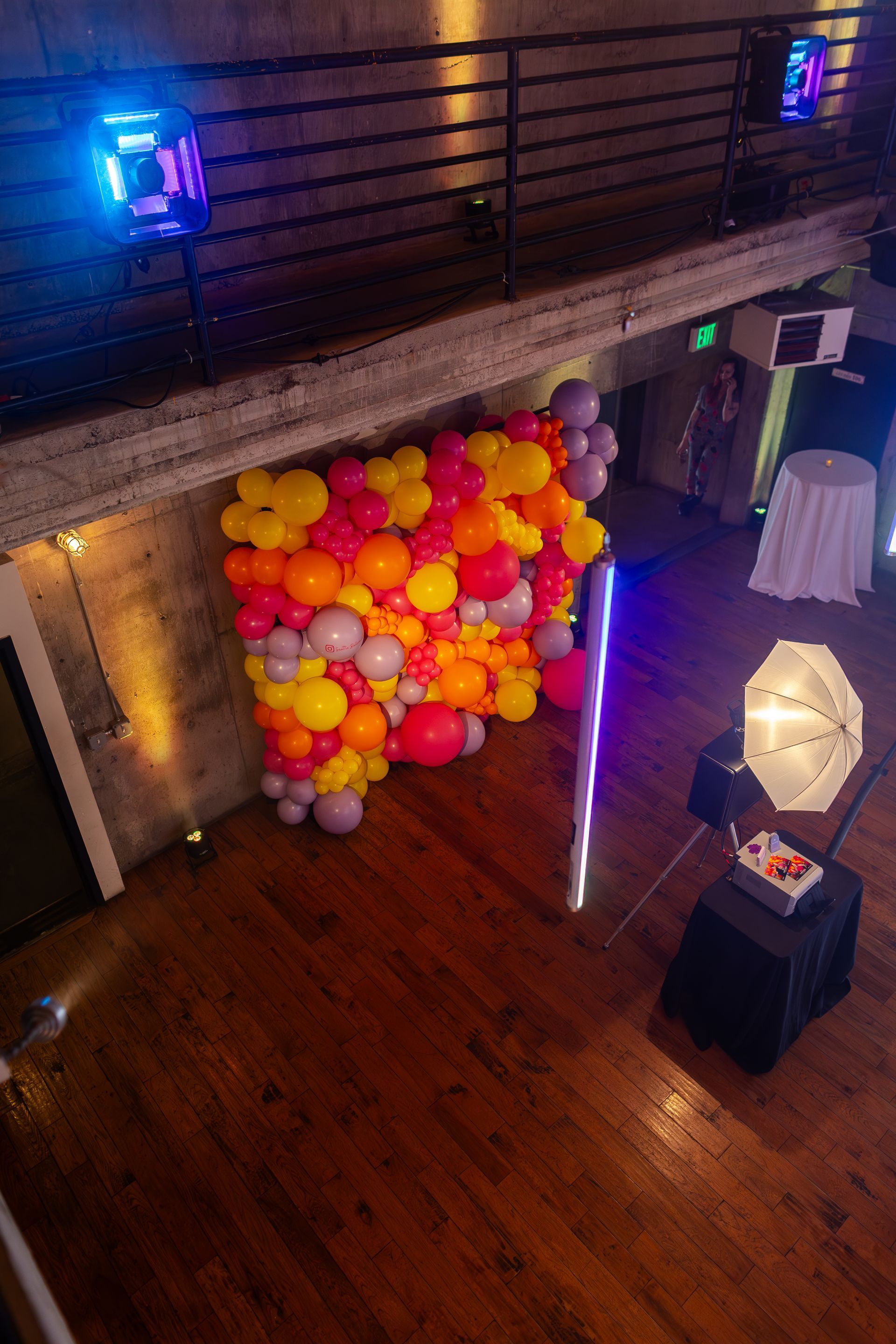 An aerial view of a room filled with colorful balloons.