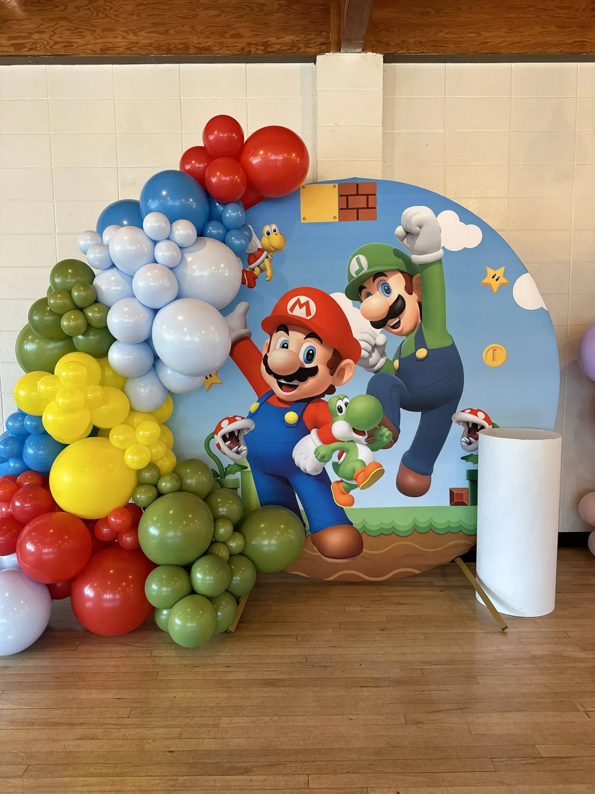 There is a picture of mario and luigi surrounded by balloons.
