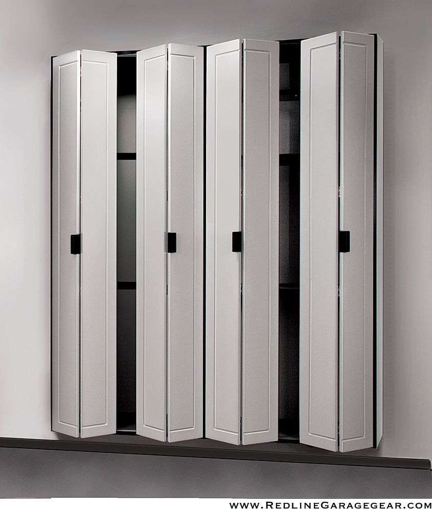 Silver metal lockers with several doors slightly open against a plain wall