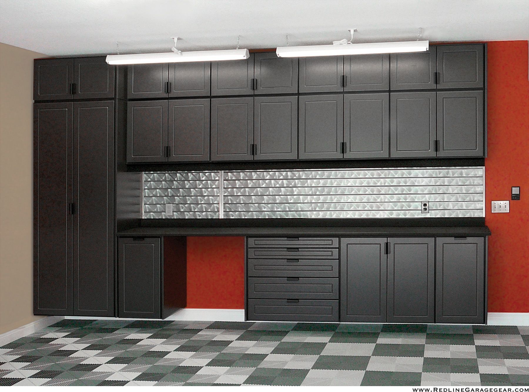 Black garage storage cabinets with countertop, tiled backsplash, and checkered floor in a workshop-like room