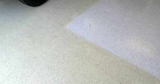 Epoxy Floor coating that is turning amber due to exposure to sunlight, losing its appeal after little more than one year since being applied on this garage floor
