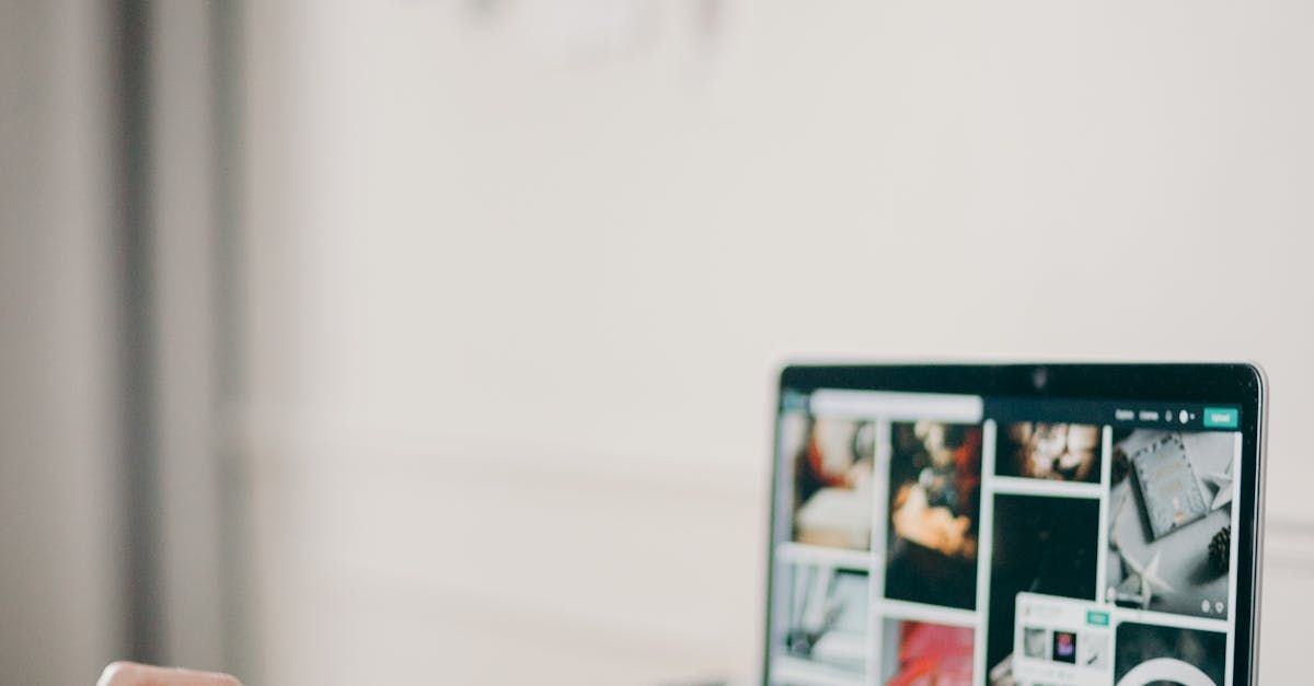 A person is using a laptop computer on a desk.