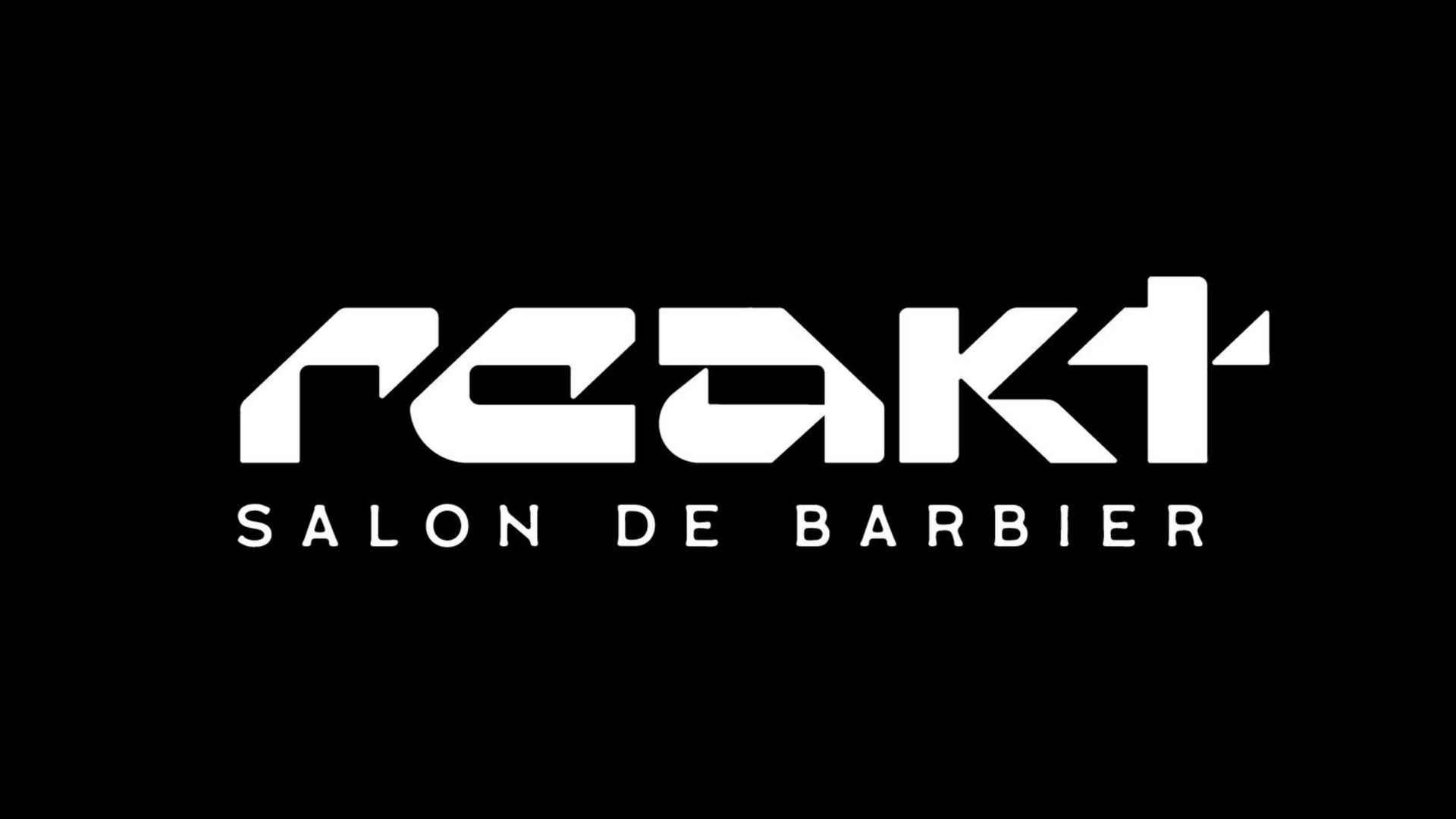 White text on a black background reading "REAKT SALON DE BARBIER" in a bold, stylized, modern font.