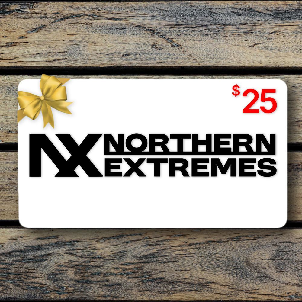 a gift card for northern extremes snowmobiling is sitting on a wooden table .