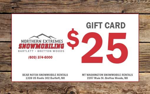 a gift card for northern extremes snowmobiling is sitting on a wooden table .