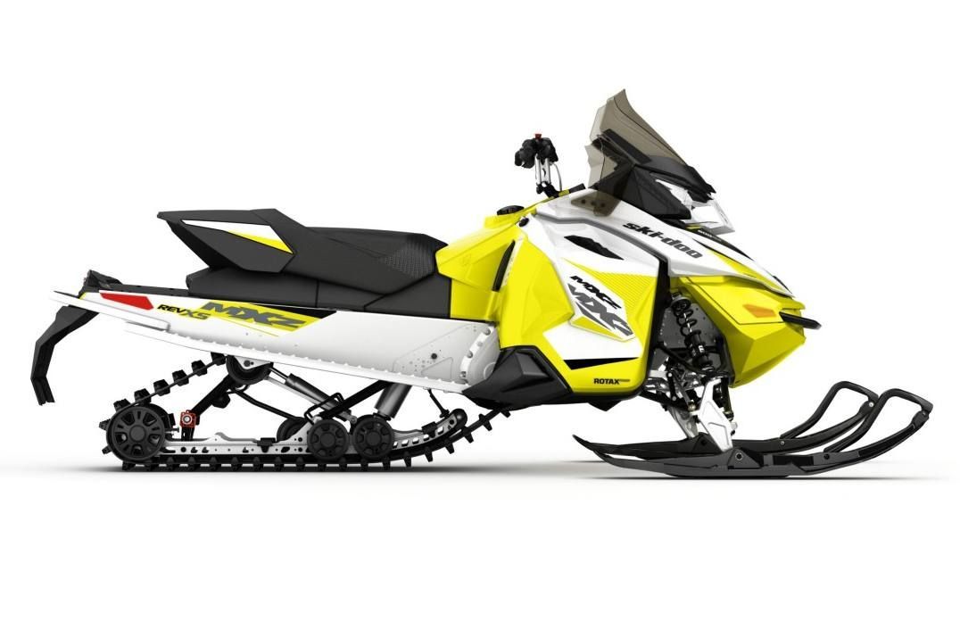 a yellow and white ski doo snowmobile on a white background