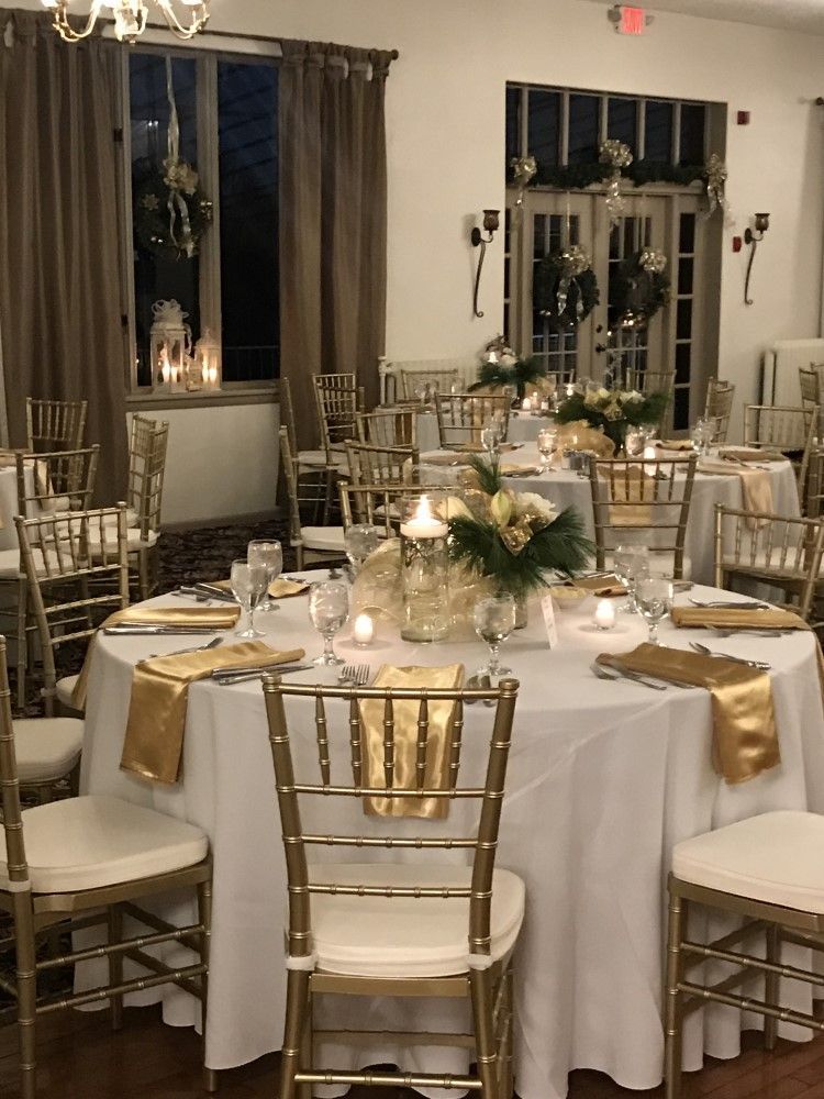 A room with tables and chairs set up for a party
