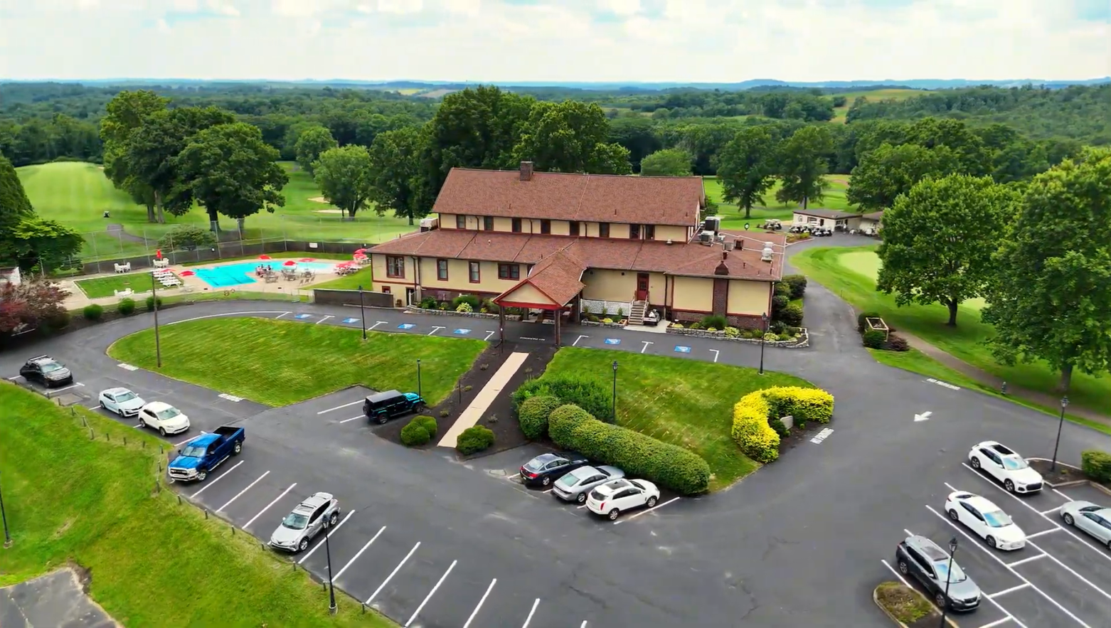 A large building with a lot of windows is lit up at night.