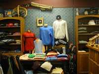 A display of shirts and hats in a store