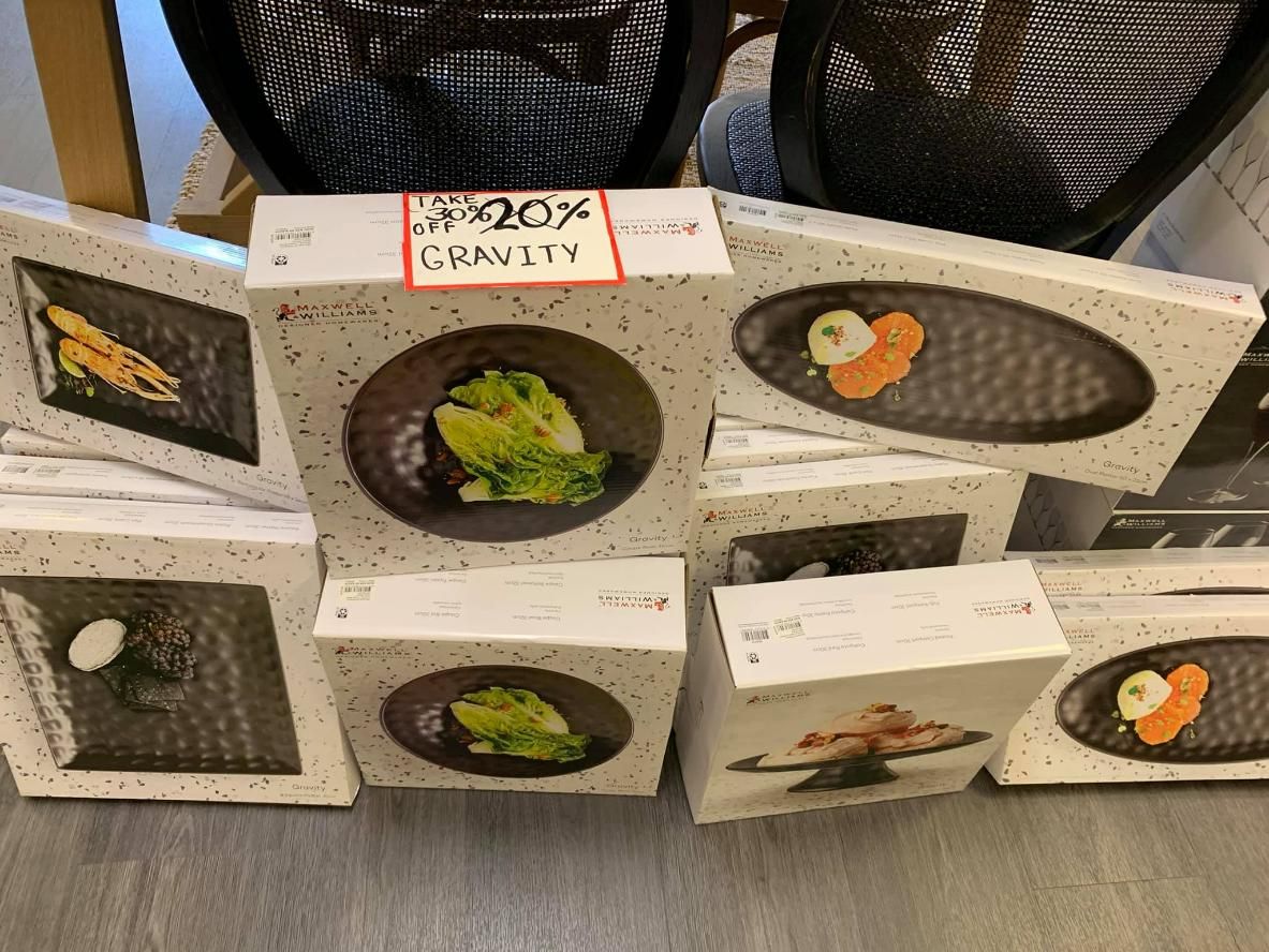 A Bunch Of Boxes Of Food Are Stacked On Top Of Each Other On A Table — InHouse Homewares in Forster, NSW