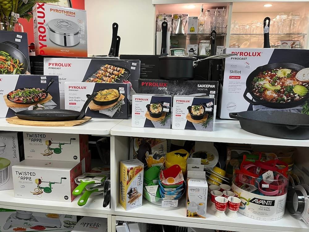 A Shelf Filled With A Variety Of Pots And Pans — InHouse Homewares in Forster, NSW