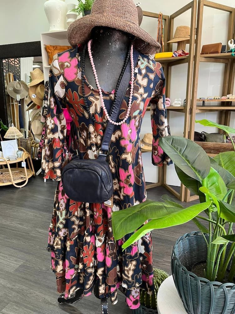 A Mannequin Is Wearing A Floral Dress And A Hat — InHouse Homewares in Forster, NSW