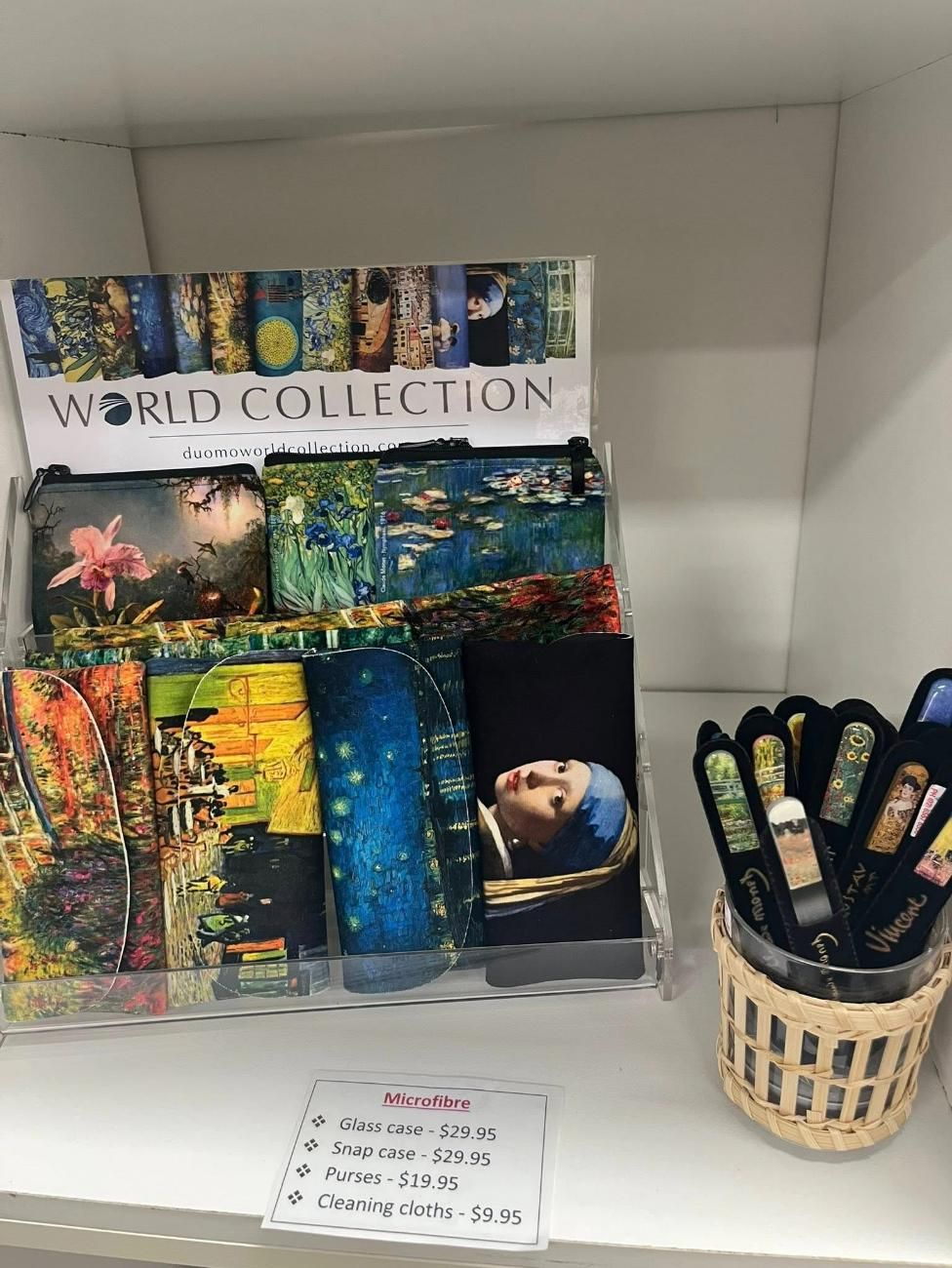 A Display Of Wallets With Paintings On Them Is On A Shelf Next To A Pen Holder — InHouse Homewares in Forster, NSW