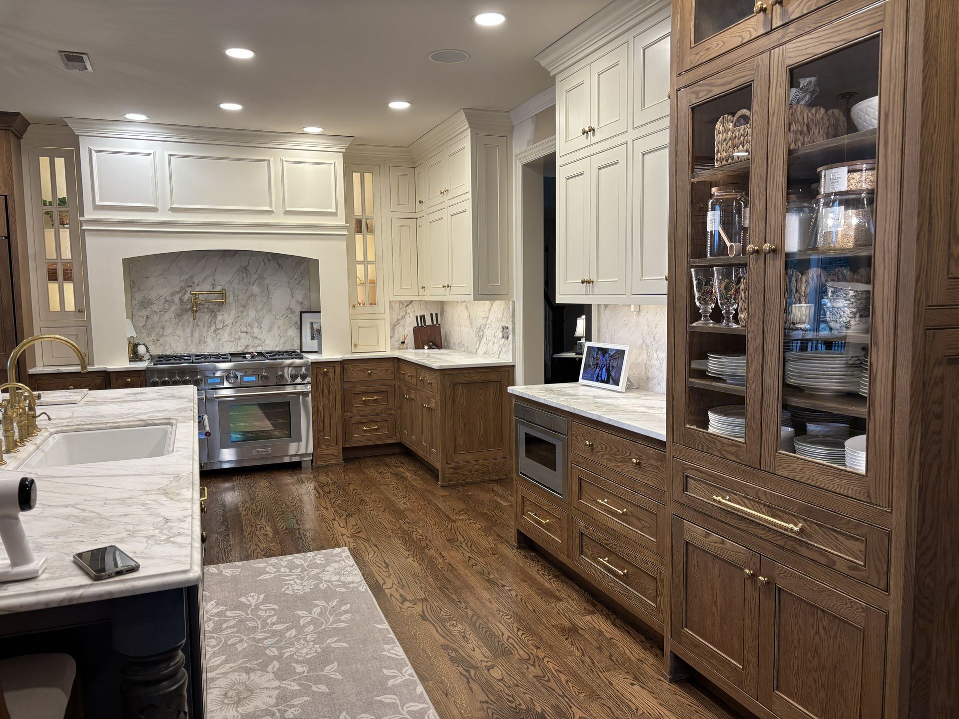 Custom beaded inset kitchen with stained white oak base cabinets and painted upper cabinets