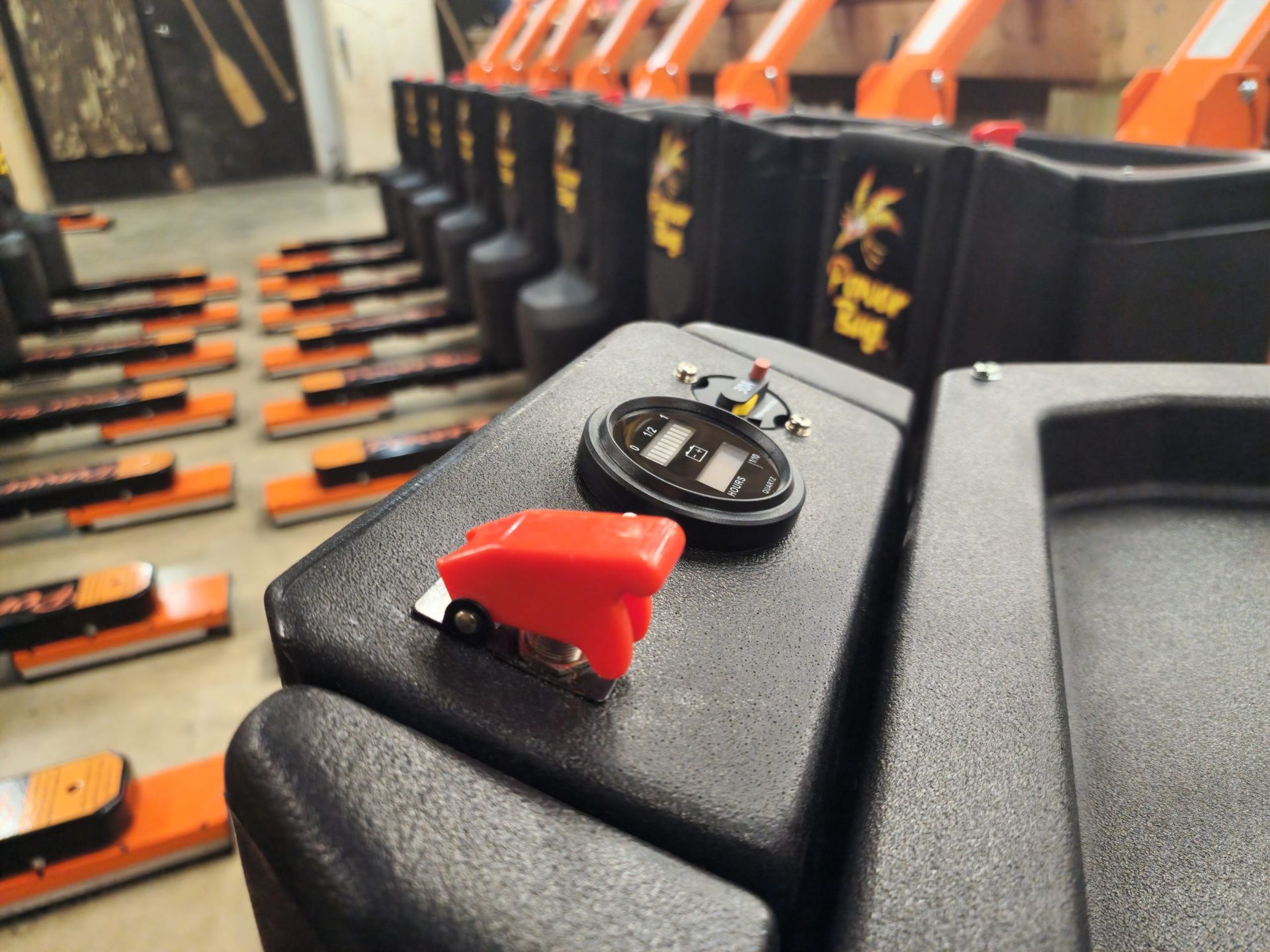 A close up of a red switch on a black box