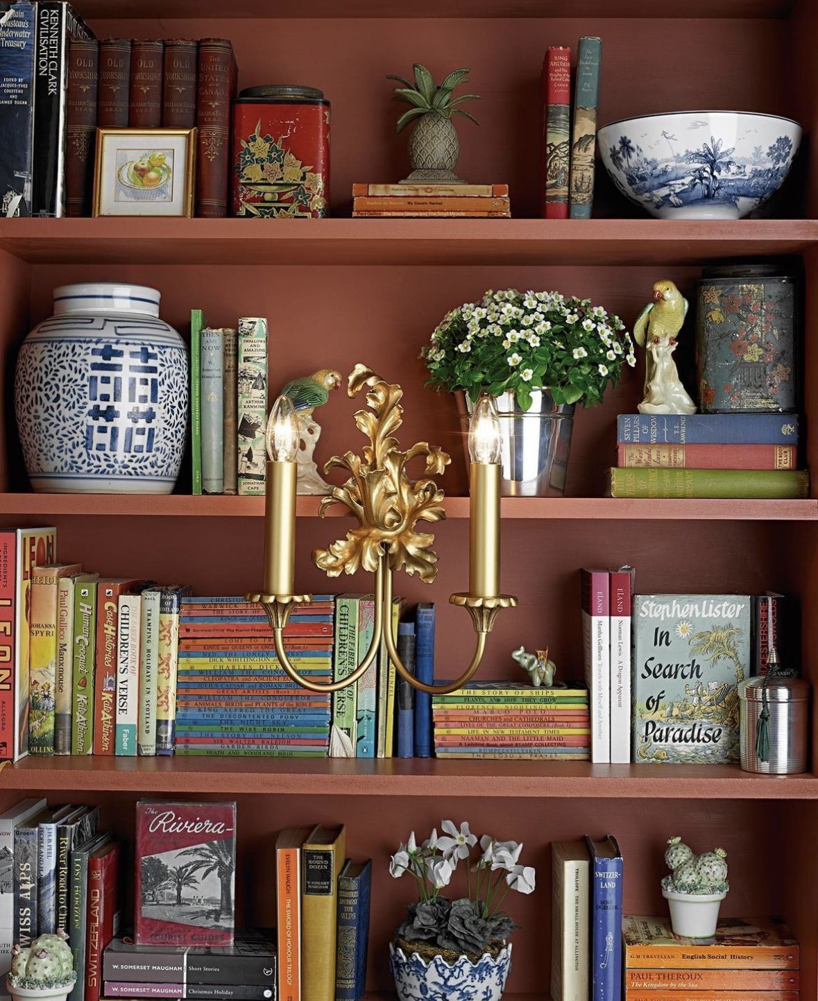 decorated bookshelf with antique finds