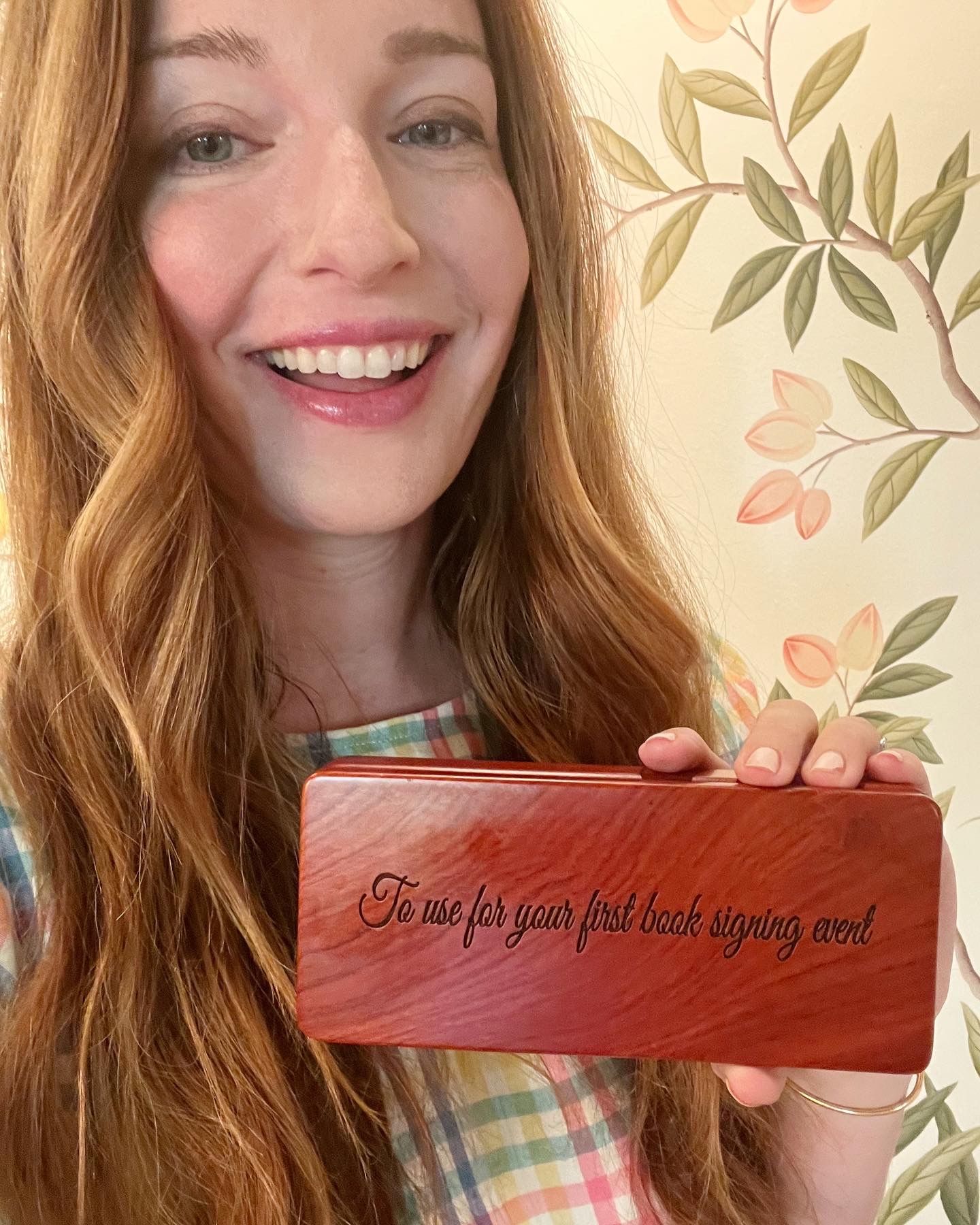 Liz Lidgett with book signing pen