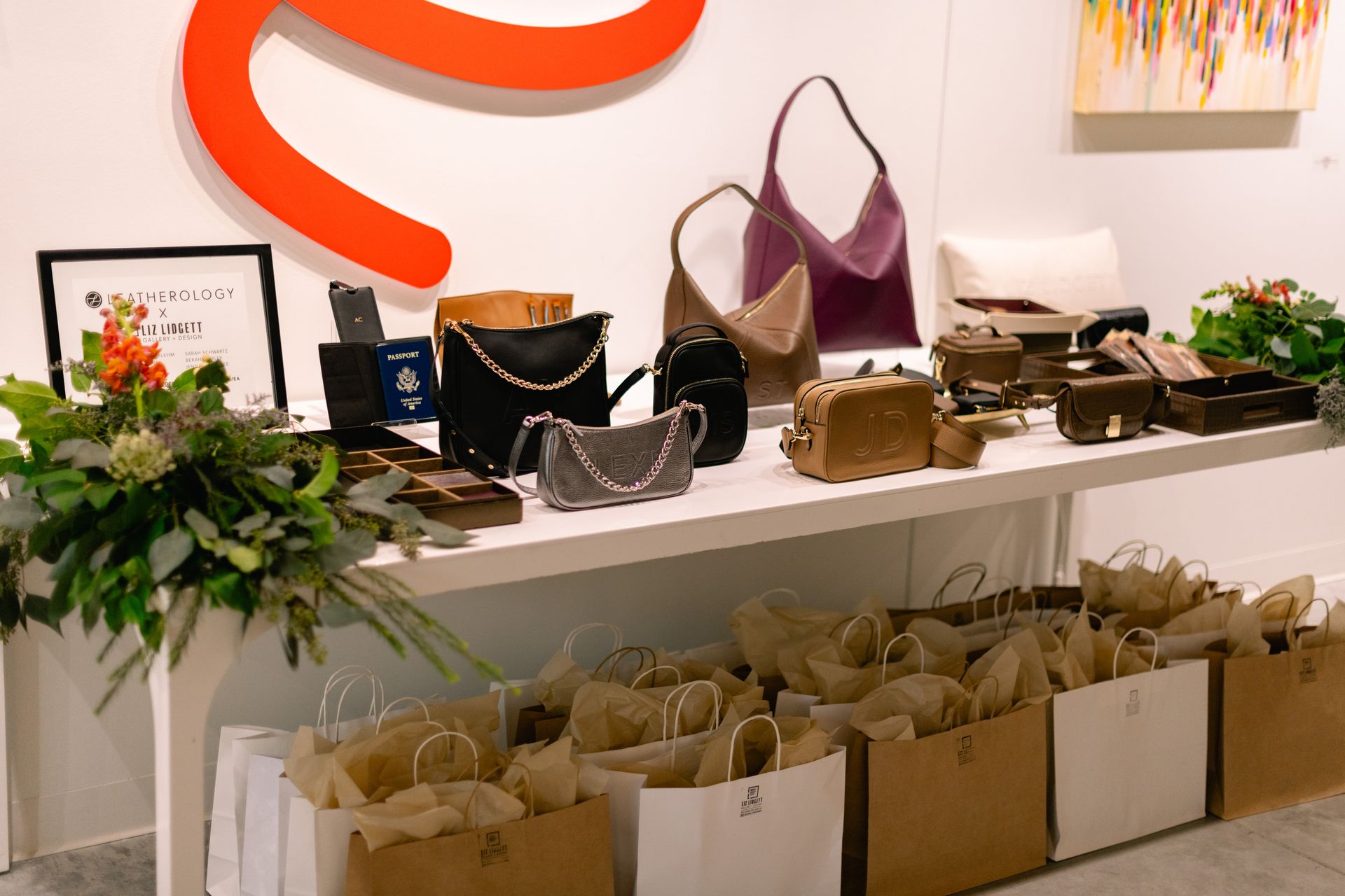 Leatherology's Executive Director, Laura Osier admiring the collection of bags