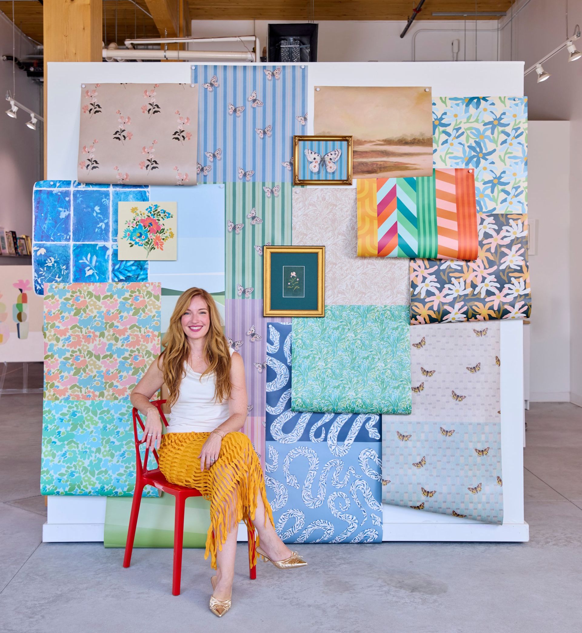 Liz posed with all the wallpaper designs