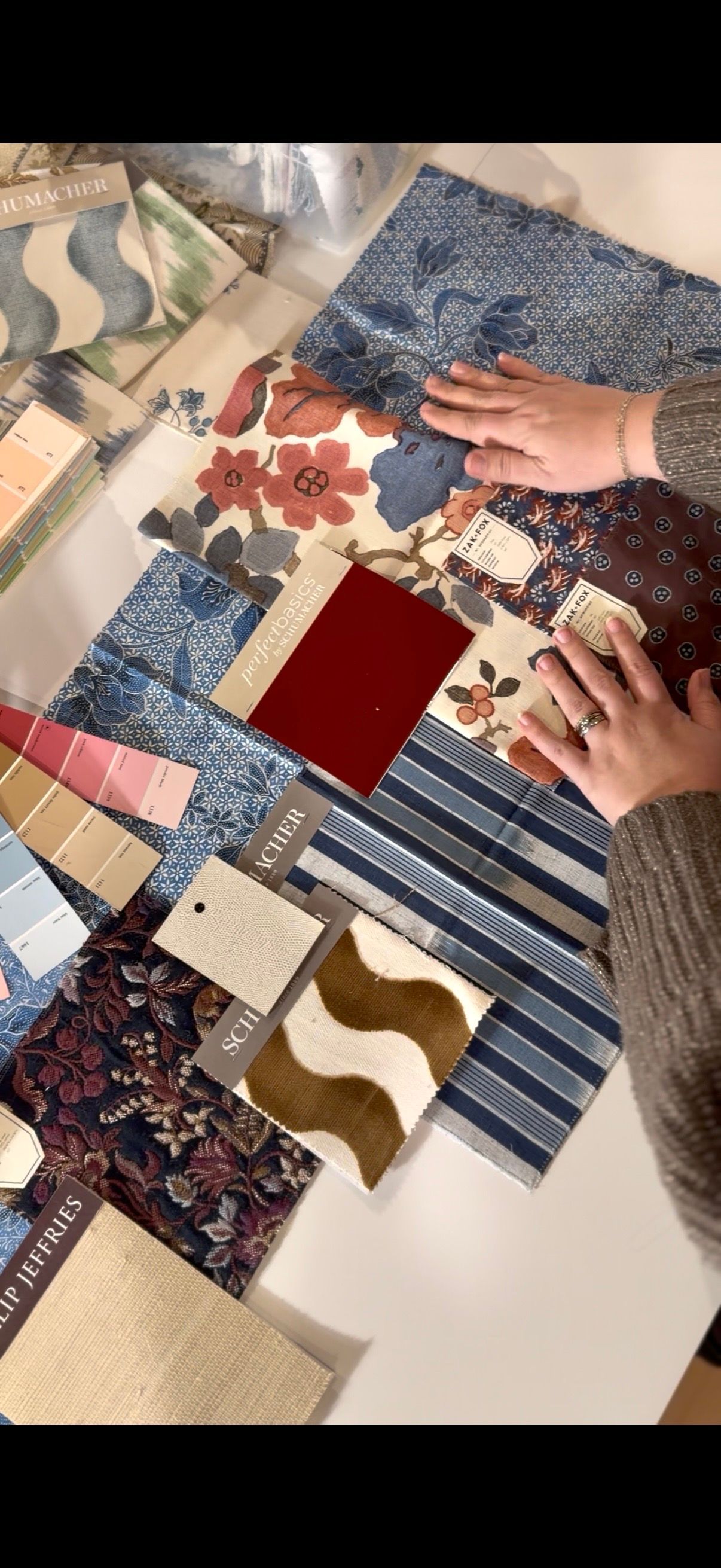 Hannah touching fabrics