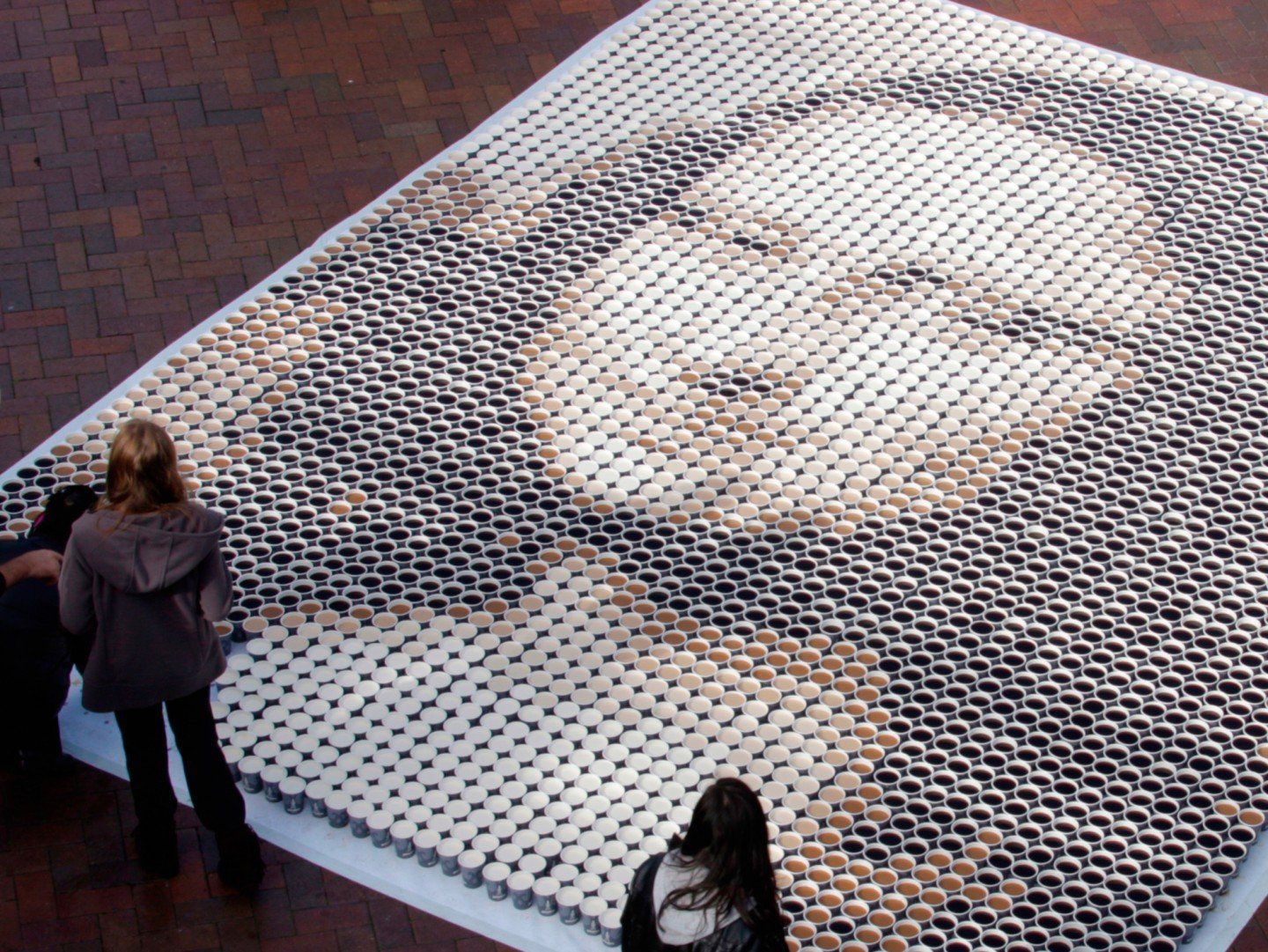 Created for The 2009 Rocks Aroma Festival in Sydney, Australia, this Mona Lisa was seen by 130,000 people who attended the one-day coffee-lovers event. The Coffee Mona Lisa was made up of 3,604 cups of coffee. Each cup was filled with varying amounts of milk to black coffee. It measured 20 feet high and 13 feet wide and took a team of eight people three hours to complete.