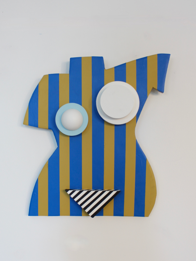 body figurine featuring blue and yellow stripes with geometric abstractions