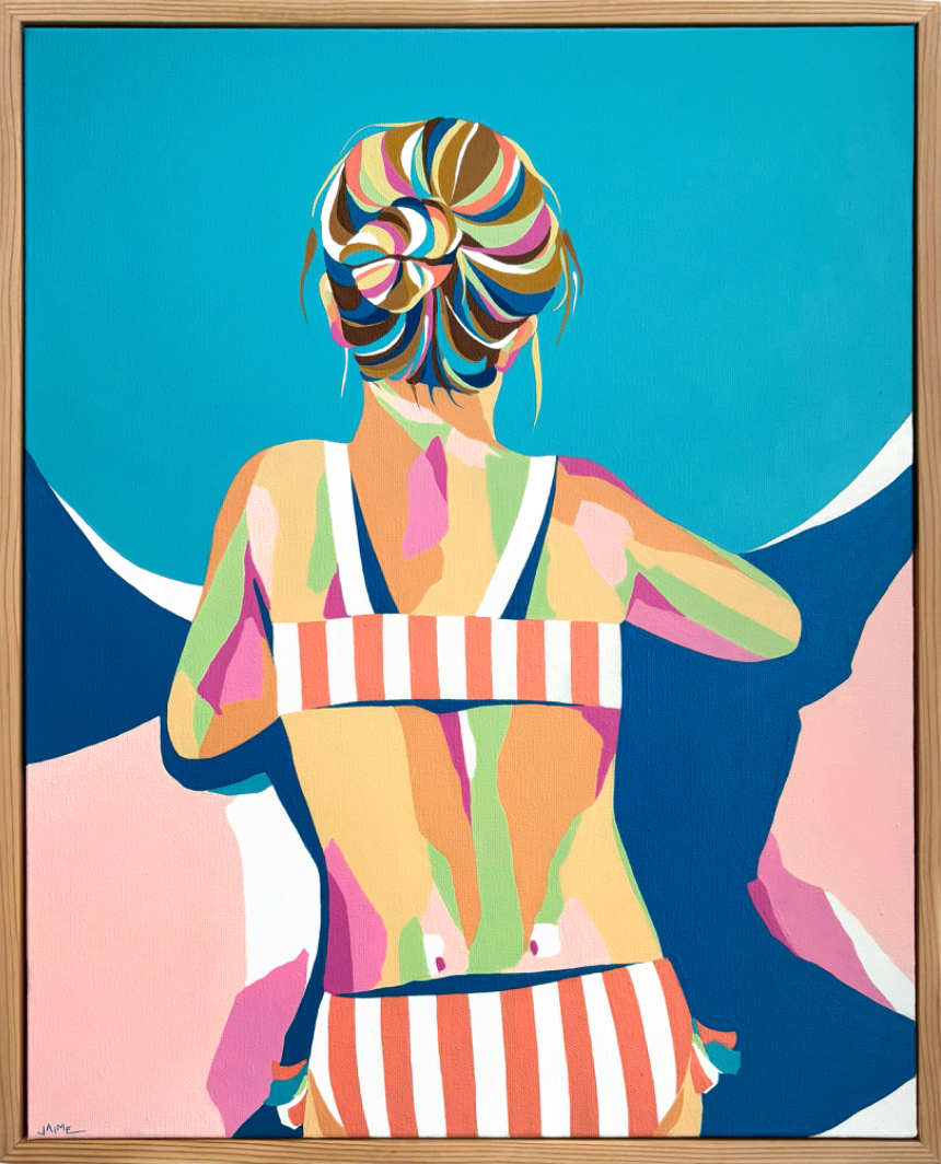 Woman sitting with back facing in striped bathing suit and her hair tied in a bun