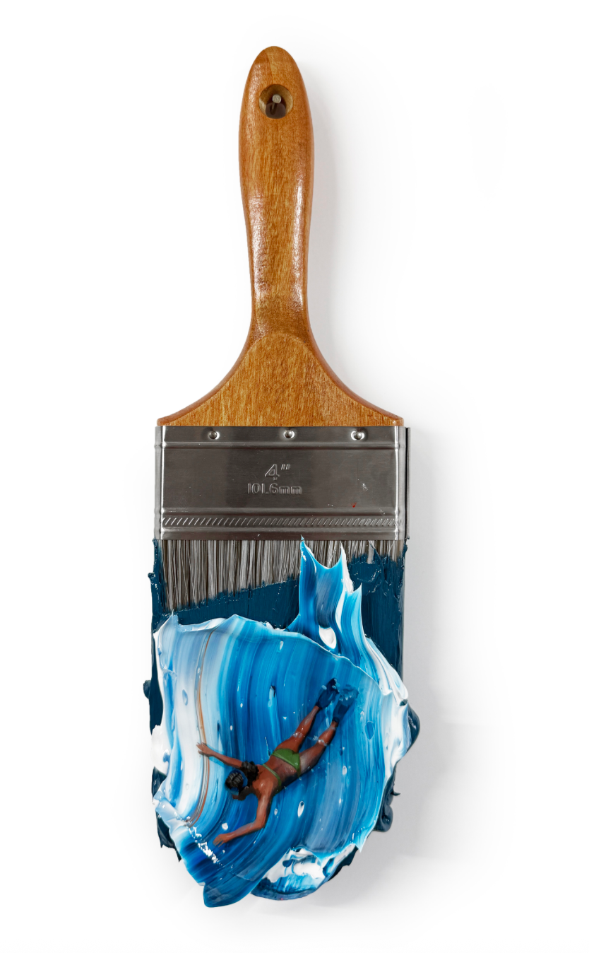 blue and white wave background with woman wearing green swimsuit and flippers acting as through she is swimming through the wave