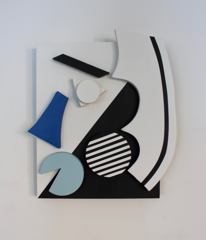 Face featuring blue, white, and black three dimensional geometric abstractions